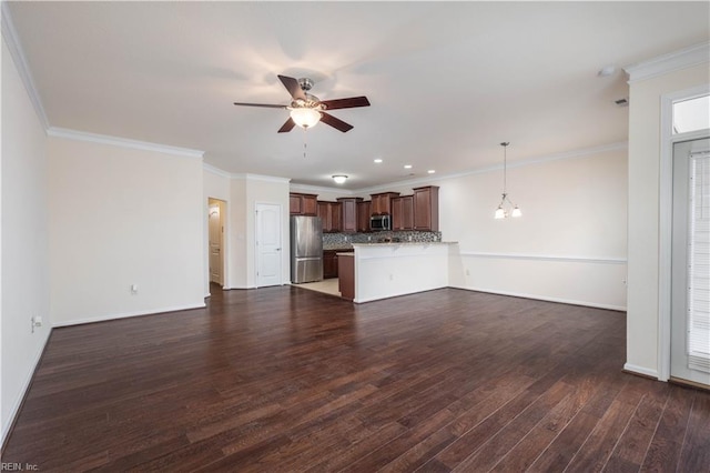 unfurnished living room featuring crown molding, dark wood-type flooring, and ceiling fan