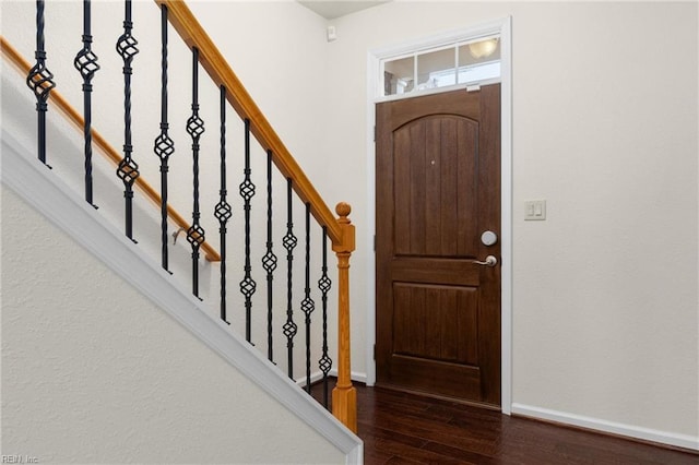 entrance foyer featuring dark hardwood / wood-style flooring