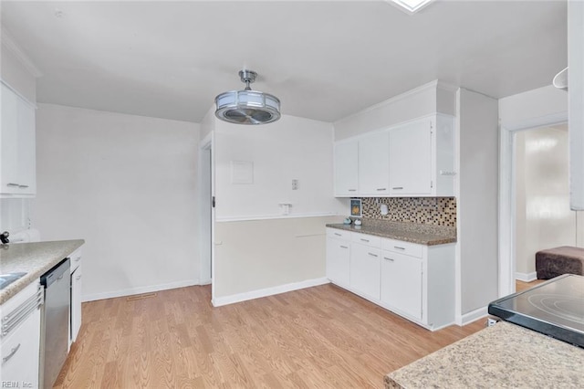 kitchen with dishwasher, white cabinets, light wood-type flooring, and decorative backsplash