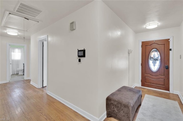 foyer entrance with light hardwood / wood-style flooring