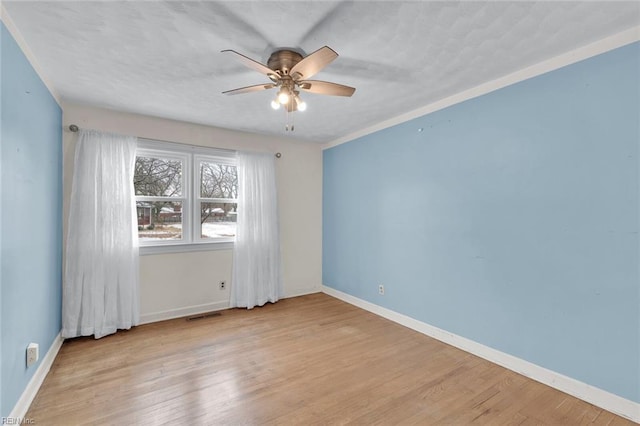 unfurnished room featuring ceiling fan and light wood-type flooring