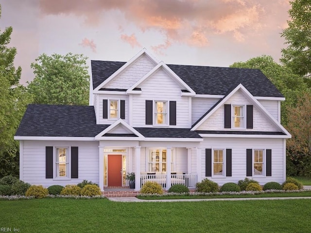 view of front of home with a yard and covered porch