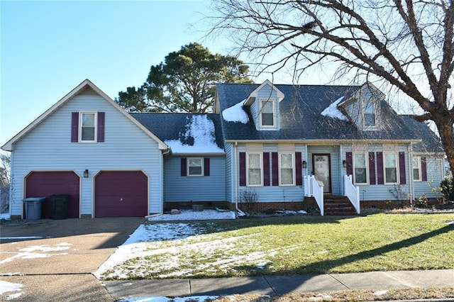 cape cod home with a garage and a front yard