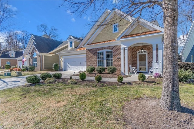 view of front of home with a garage and a front lawn