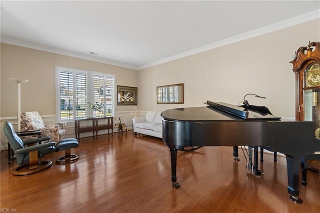 sitting room featuring crown molding and hardwood / wood-style flooring