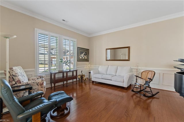 living room with crown molding and dark hardwood / wood-style floors