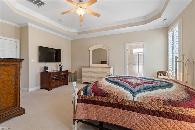 carpeted bedroom featuring ornamental molding, a raised ceiling, and ceiling fan