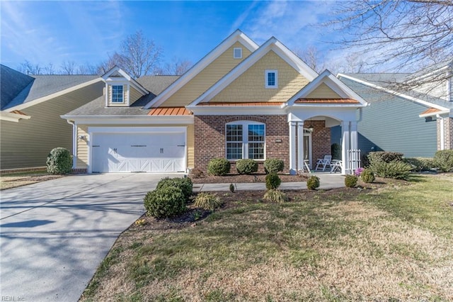 craftsman-style house with a garage, a front lawn, and a porch