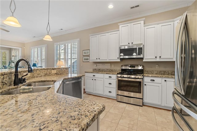 kitchen with stainless steel appliances, sink, and white cabinets