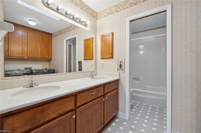 bathroom with vanity, tile patterned flooring, and shower / bathing tub combination