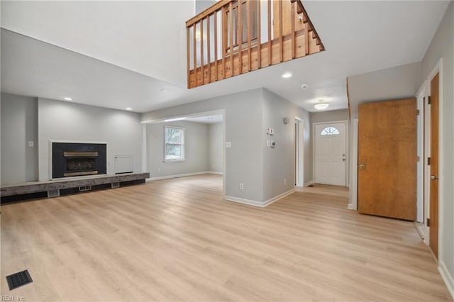 unfurnished living room featuring light hardwood / wood-style floors