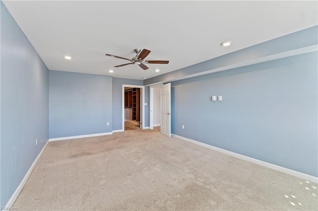 unfurnished bedroom featuring light carpet and ceiling fan