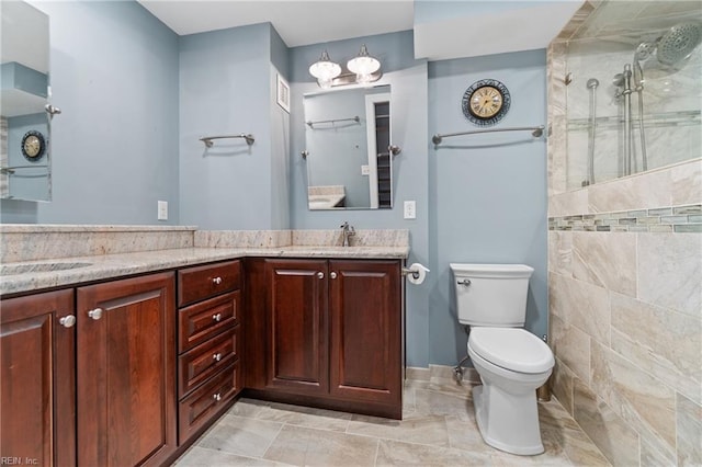 bathroom with vanity, walk in shower, and toilet