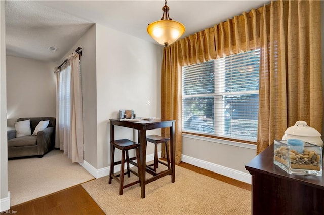 dining space with light wood-type flooring