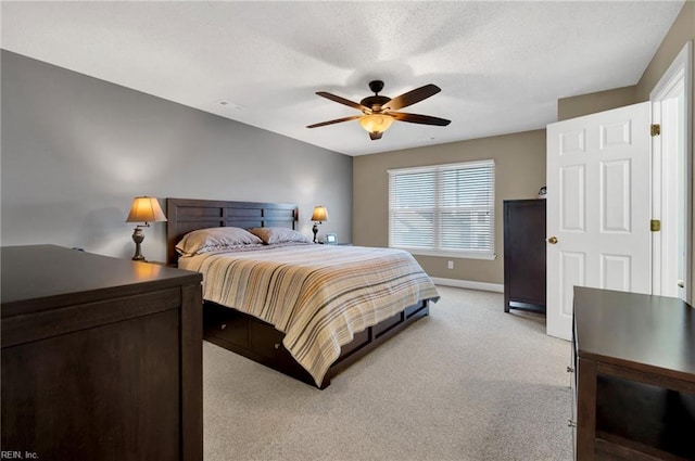 bedroom featuring light carpet and ceiling fan