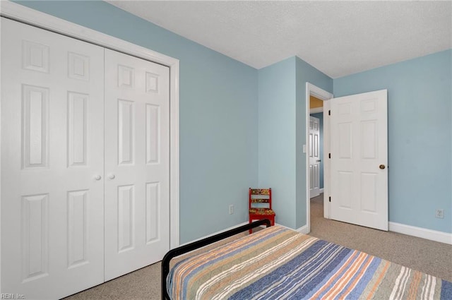 carpeted bedroom featuring a closet