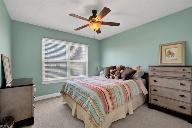 bedroom with light colored carpet and ceiling fan