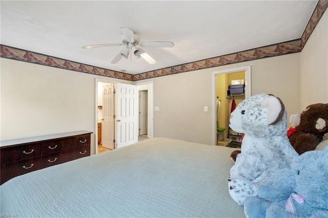 bedroom featuring connected bathroom and ceiling fan