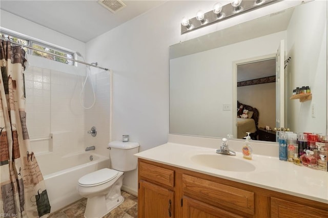 full bathroom with vanity, toilet, and shower / bath combo with shower curtain