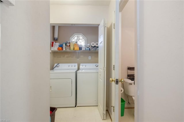 laundry room with washing machine and clothes dryer