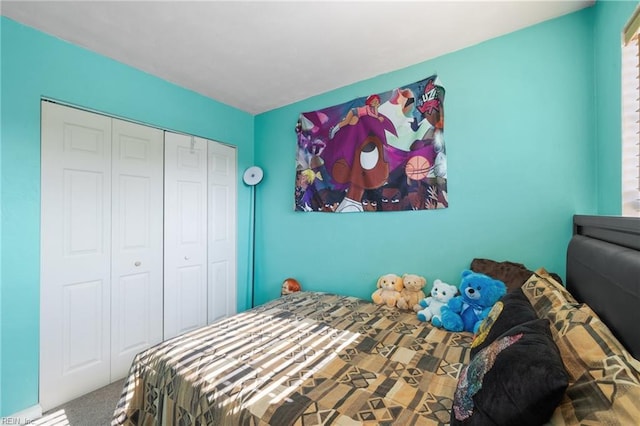 carpeted bedroom with a closet