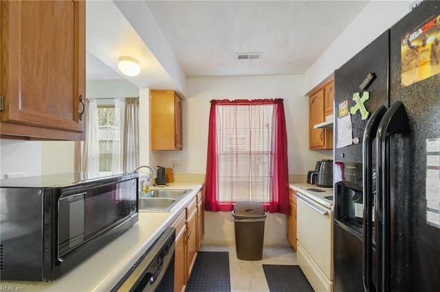 kitchen featuring sink and black appliances