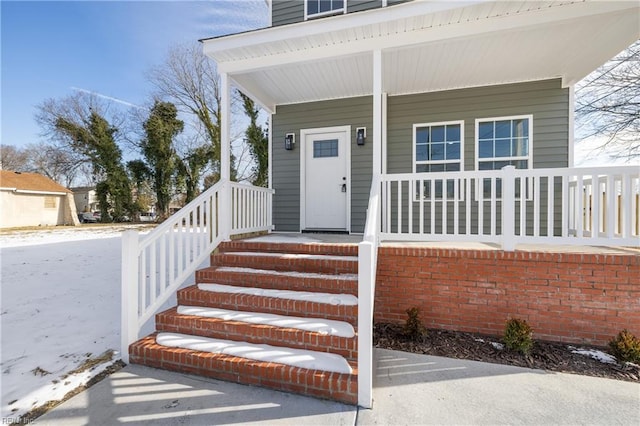 property entrance featuring a porch