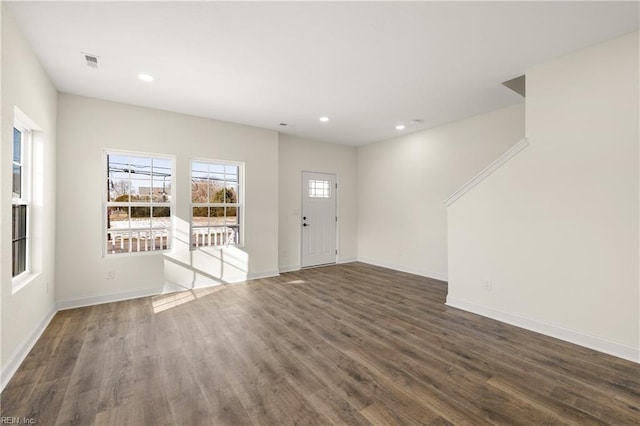 foyer with dark wood-type flooring