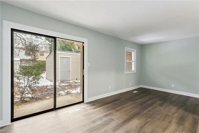 empty room featuring hardwood / wood-style flooring