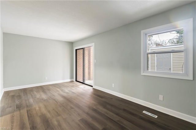 empty room with wood-type flooring