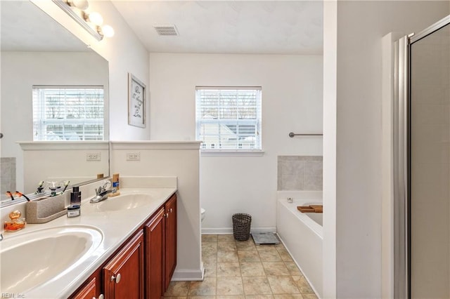 full bathroom featuring toilet, vanity, and plus walk in shower