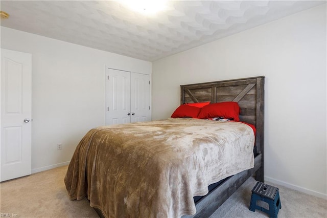 carpeted bedroom with a closet