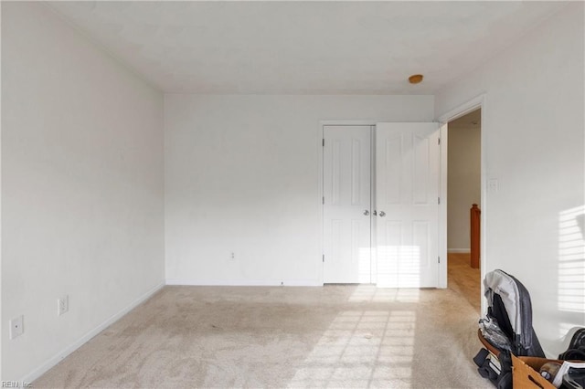 interior space featuring light colored carpet