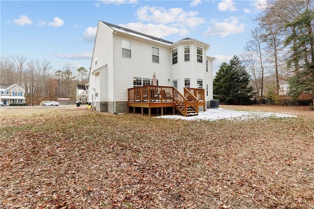 back of house with a wooden deck and central air condition unit