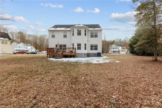 rear view of house with a wooden deck and central air condition unit