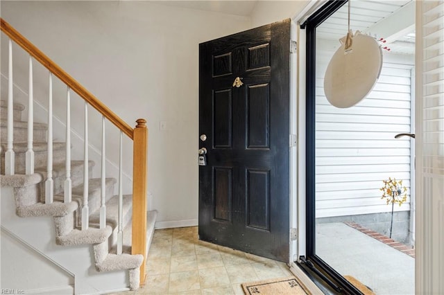 entrance foyer with light tile patterned flooring