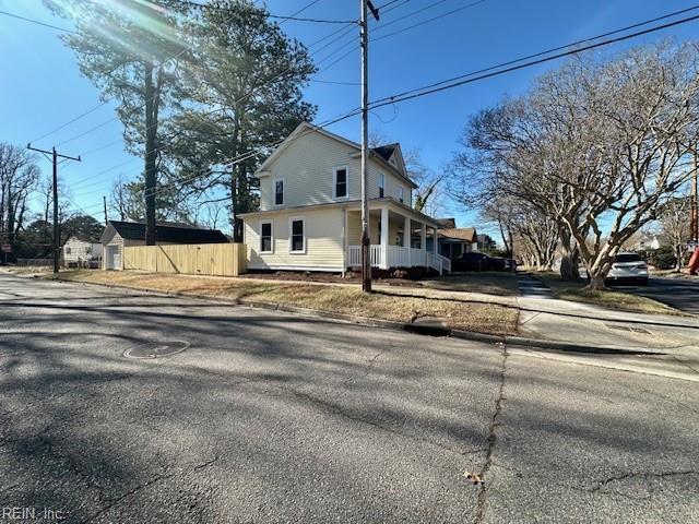 view of side of property featuring a porch