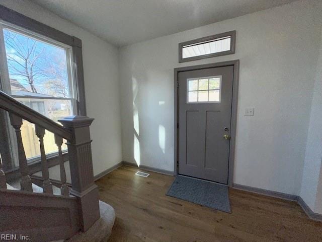 foyer entrance featuring dark hardwood / wood-style flooring