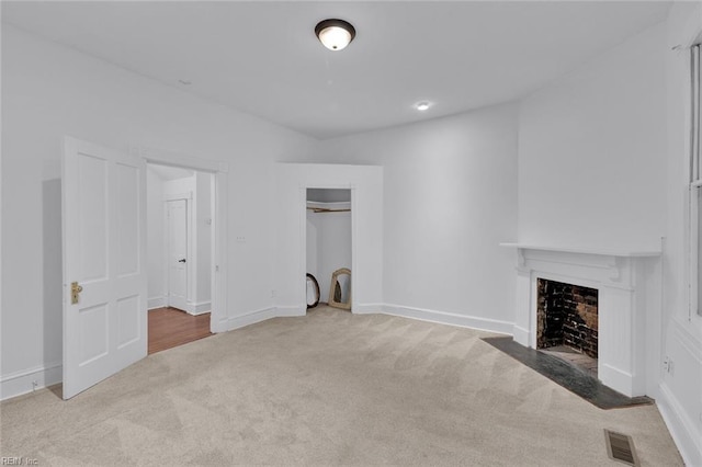 unfurnished living room with light carpet