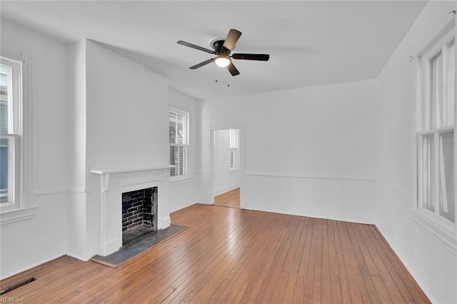 unfurnished living room featuring light hardwood / wood-style flooring and ceiling fan