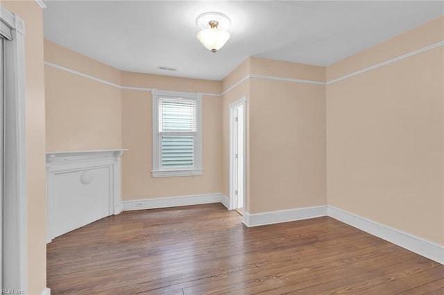 unfurnished living room featuring wood-type flooring