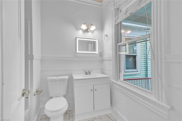 bathroom featuring vanity and toilet