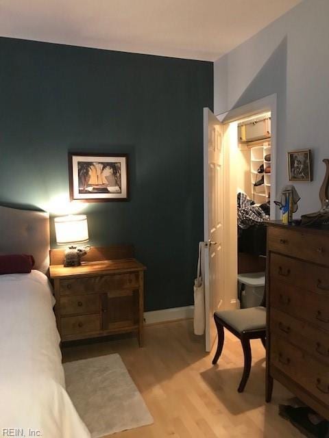 bedroom with light hardwood / wood-style flooring