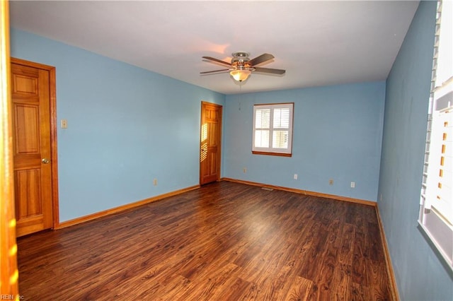 unfurnished room featuring ceiling fan and dark hardwood / wood-style flooring