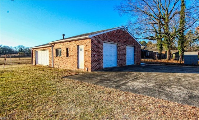 garage featuring a yard