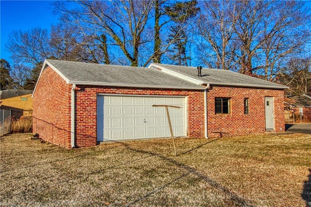 garage featuring a lawn