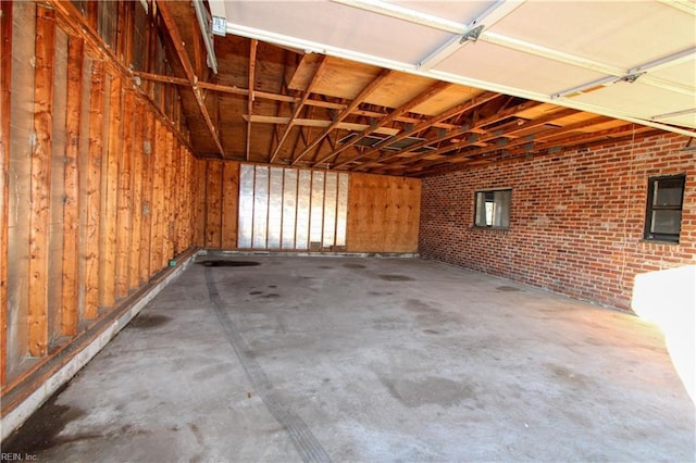 garage featuring wood walls