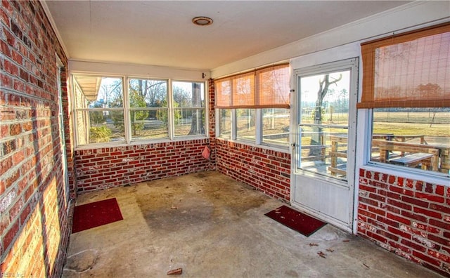 unfurnished sunroom featuring a wealth of natural light