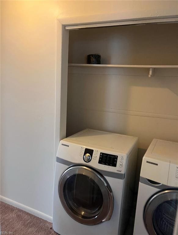 laundry area with carpet flooring and washer and clothes dryer