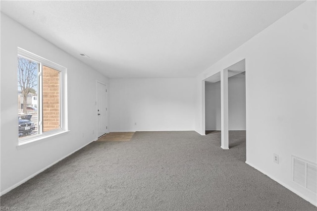 unfurnished room with carpet flooring